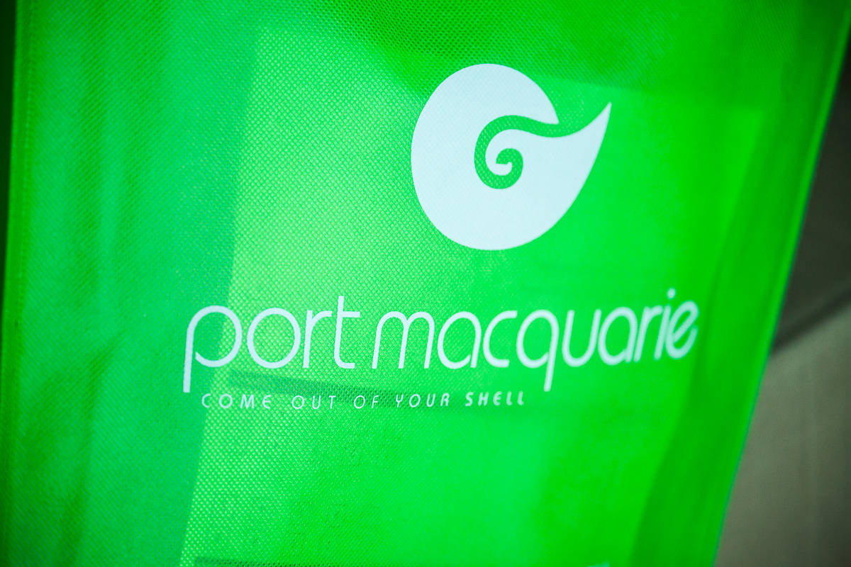 A green bag with the words port macquarie written on it.